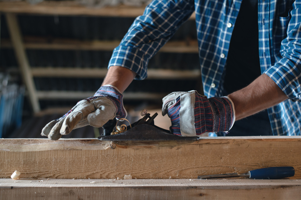 Carpenter shaving wood