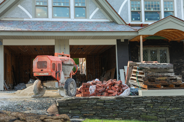 Red tractor outside house